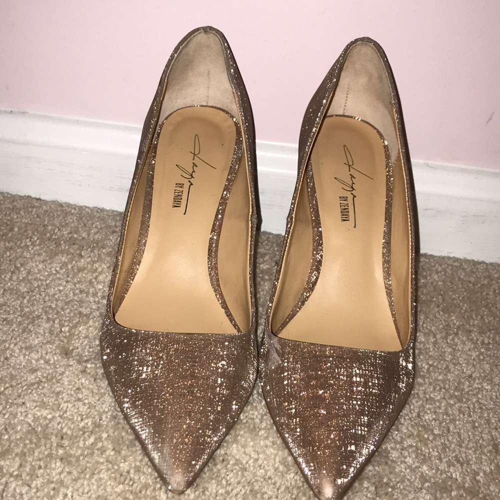 A beautiful pair of gold shimmery shoes!